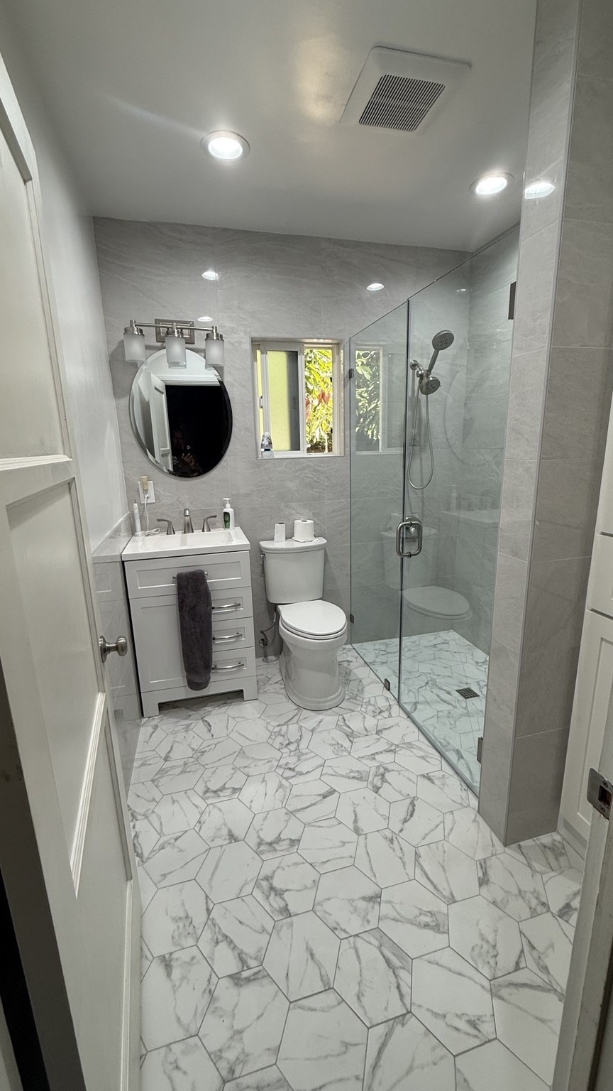 Completed ARC bathroom remodel: full bathroom with vanity and shower