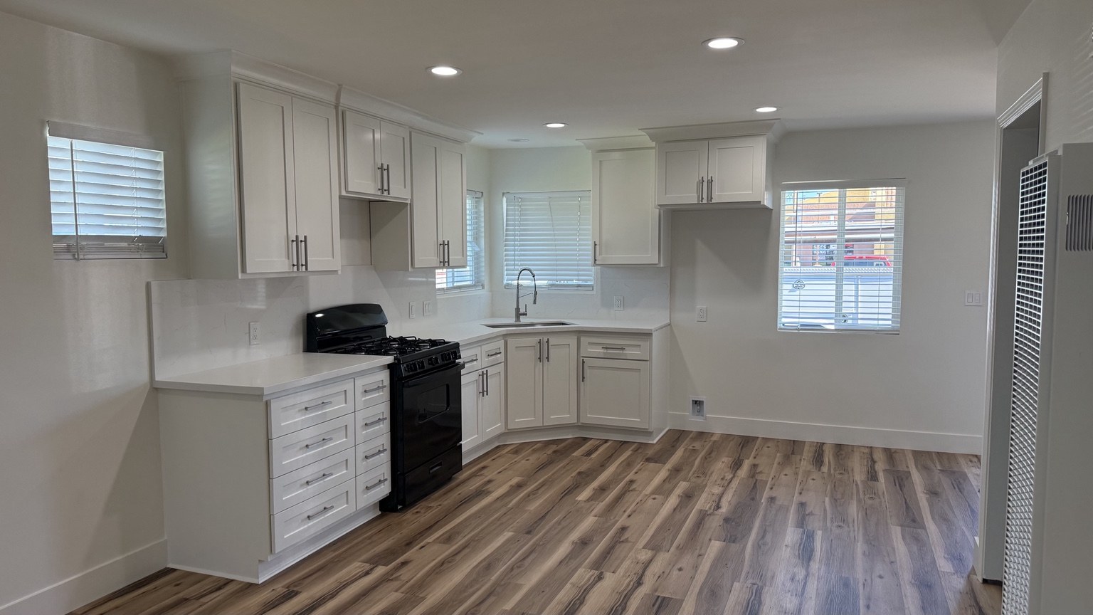 Completed ARC kitchen remodel with white cabinetry